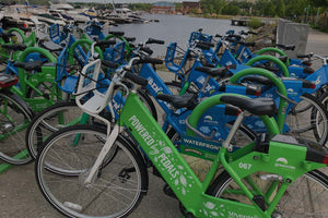 two rows of bikes used in bike sharing systems 