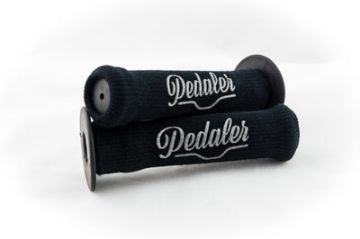 Black knit grip covers with the Pedaler logo embossed in silver